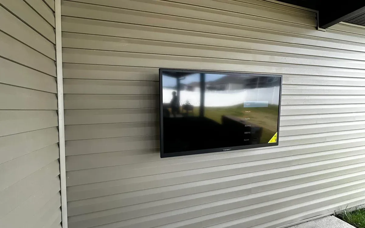 Outdoor TV mounted on covered patio