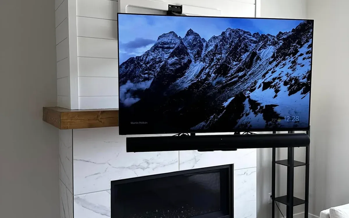 TV mount installation on shiplap fireplace wall