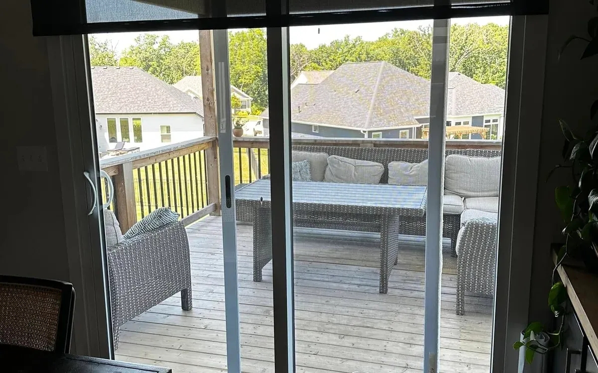 Motorized roller shade on sliding patio door