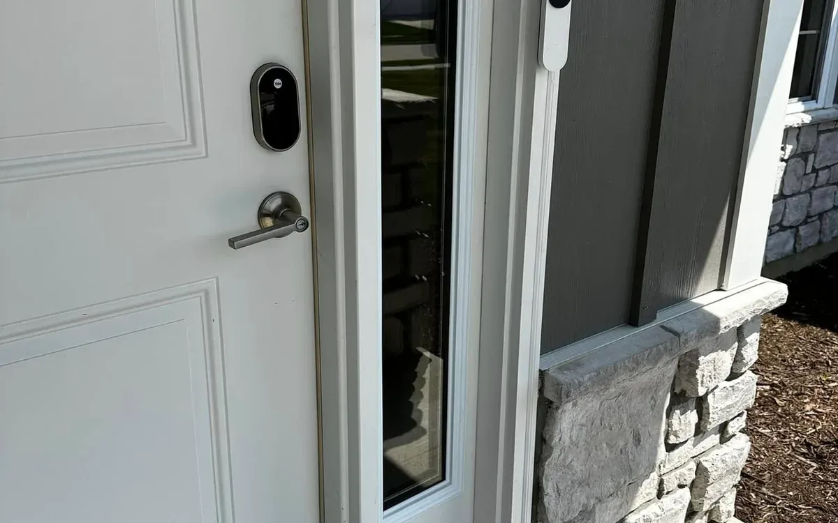 Smart lock and doorbell camera at front entry