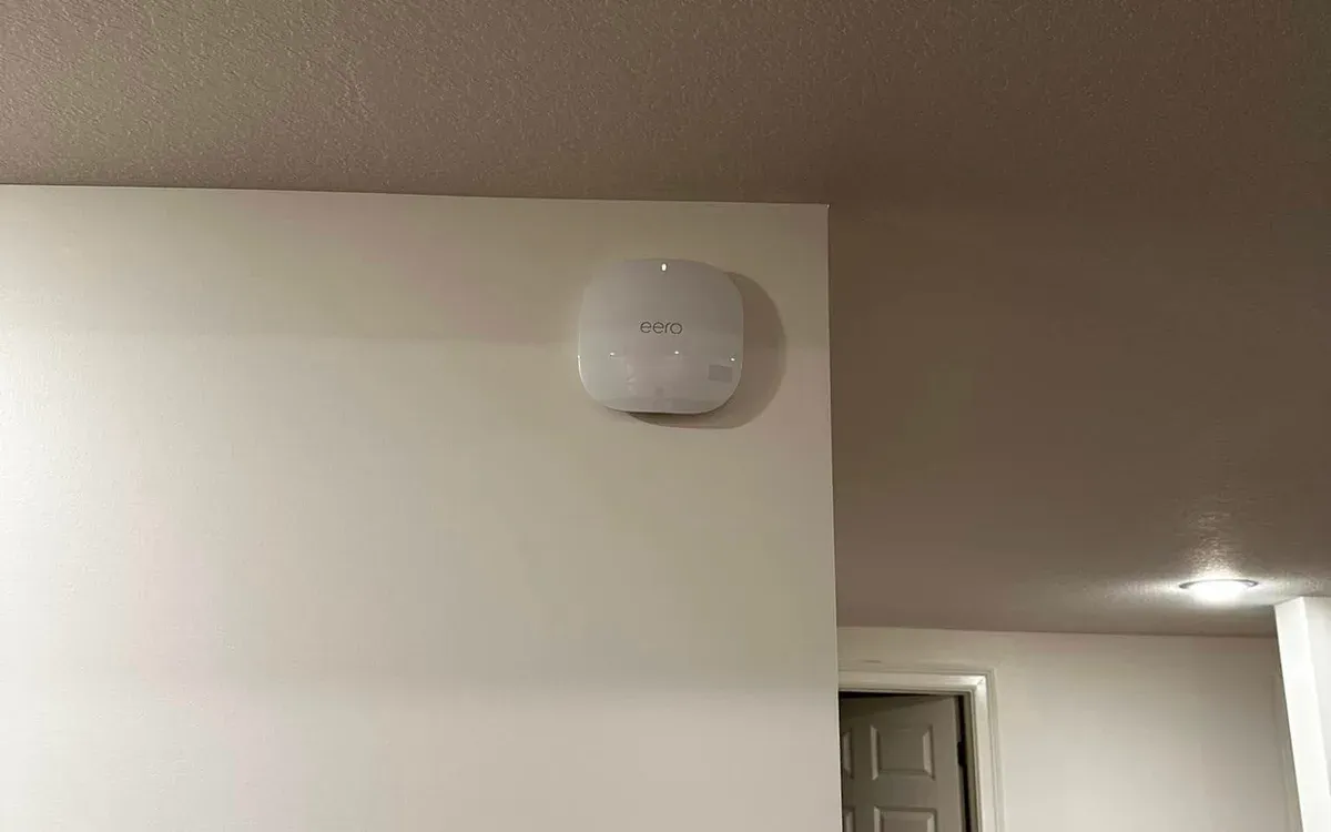 WiFi access point mounted high on wall
